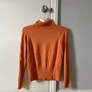 Orange turtleneck
